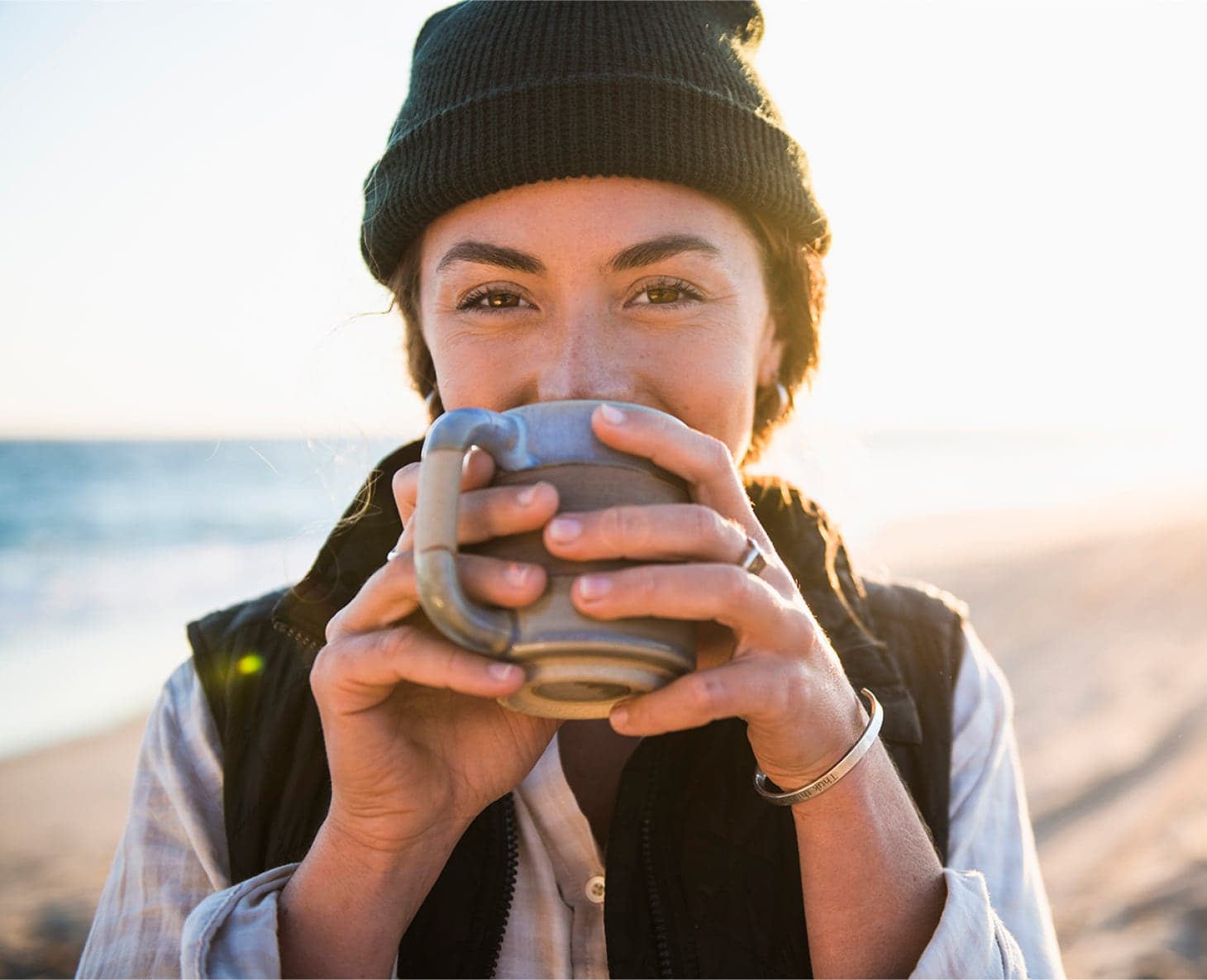 Woman sipping from cup